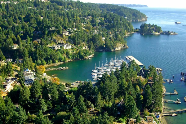 Eagle Harbour marina in West Vancouver with boats and forested shoreline; reliable exterior and window cleaning.