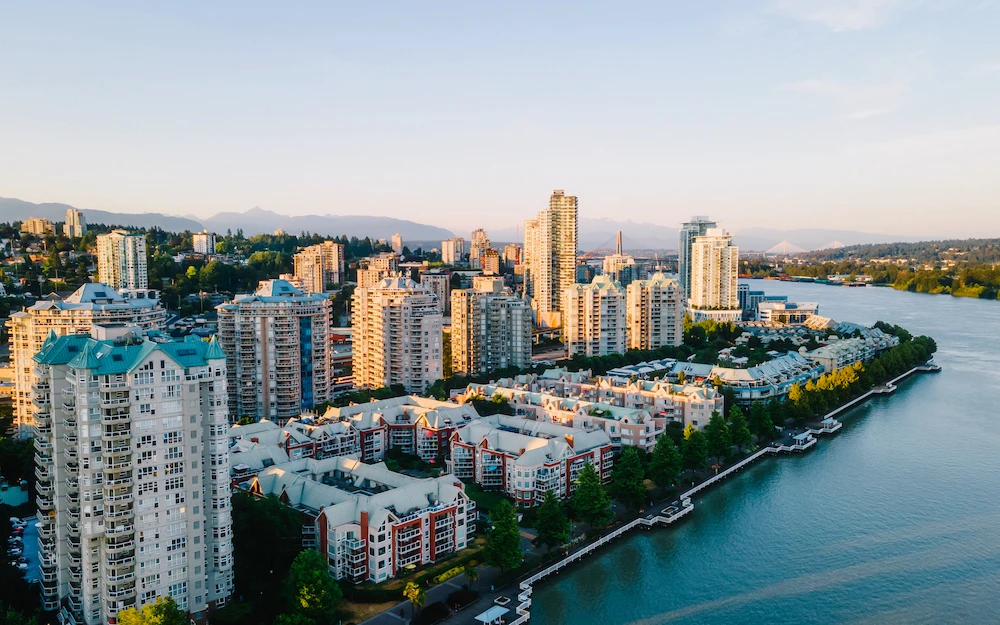 Aerial view of downtown New Westminster and Fraser River; trusted exterior, window, roof, and gutter cleaning services.