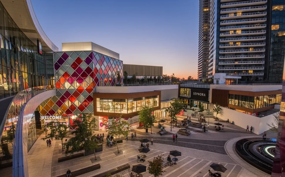 The Amazing Brentwood outdoor plaza at dusk in Burnaby; trusted exterior, roof, and soft wash cleaning specialists.