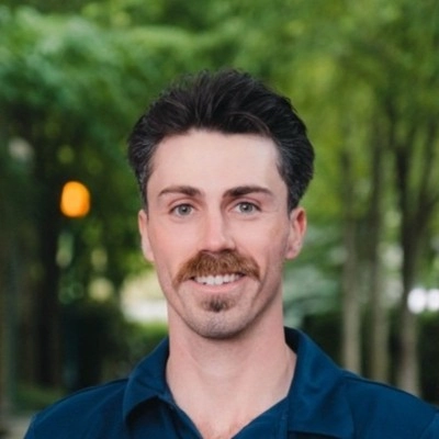 Head shot of Aidan, the founder of Washtech in the company's uniform.