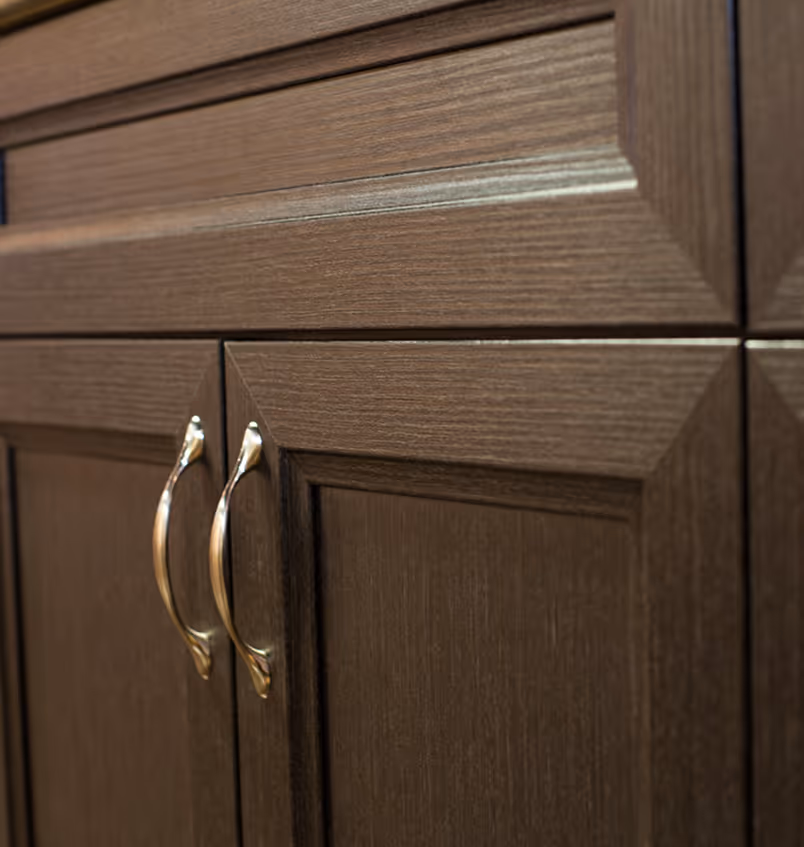 Nextek cabinet doors under a sink in a kitchen.
