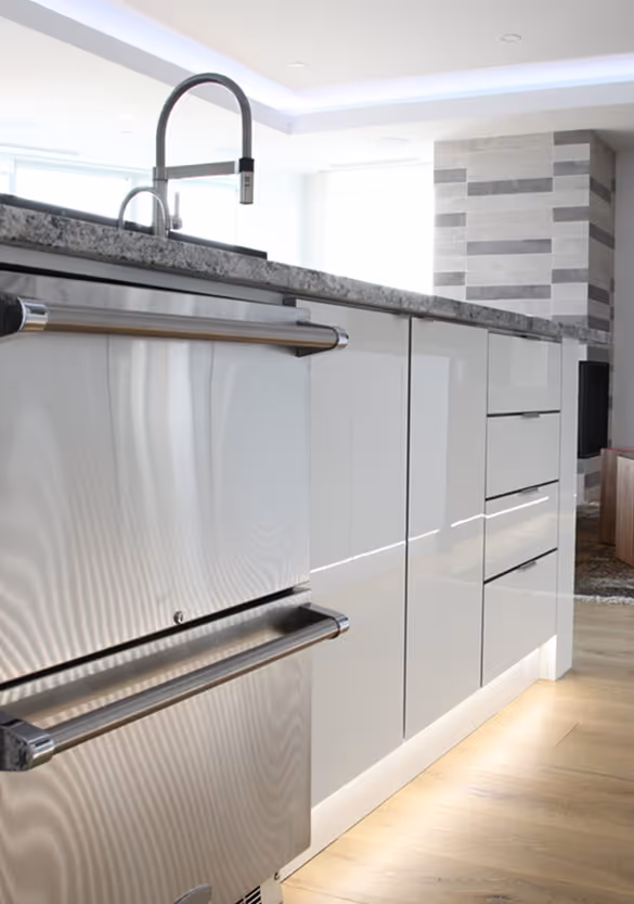 A kitchen sink with cabinets