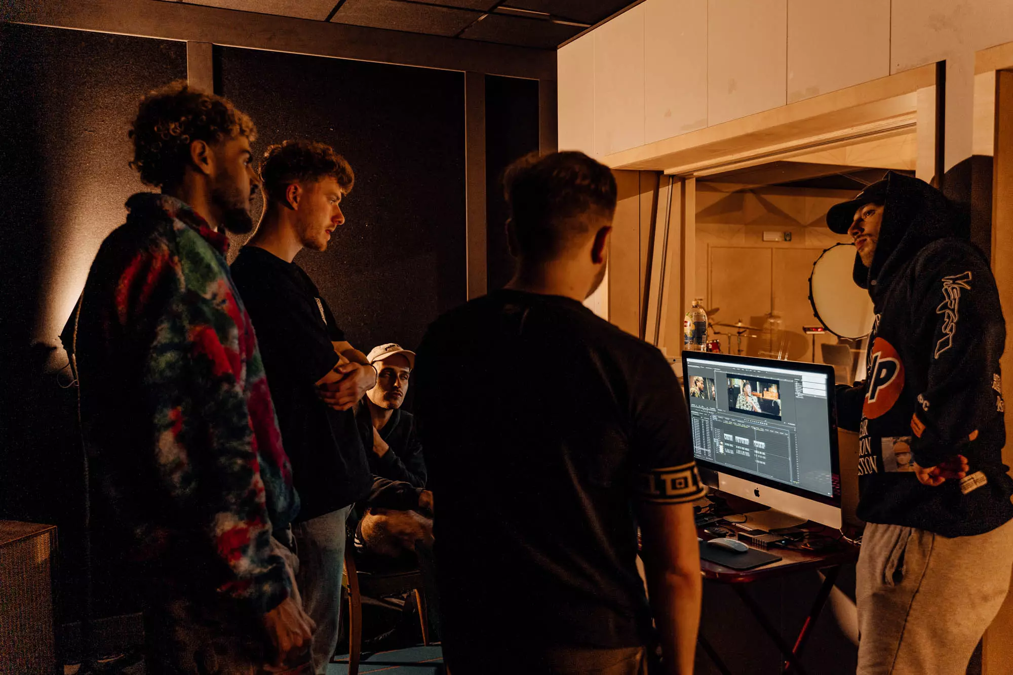 Group of people making music in a studio
