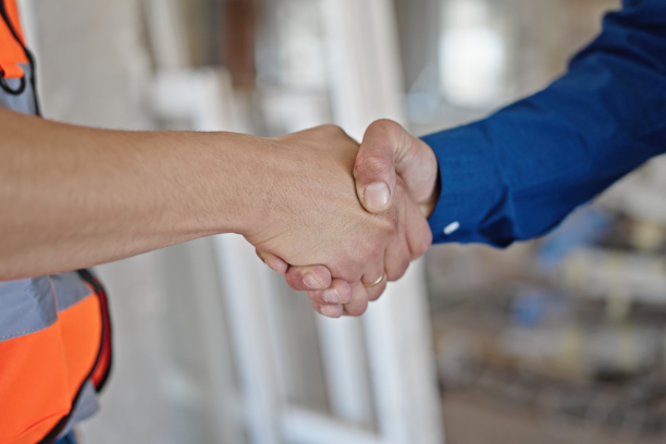 Traditional handshake between home owner and contractor