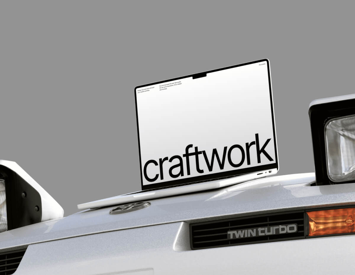 a white car with a laptop on top of it