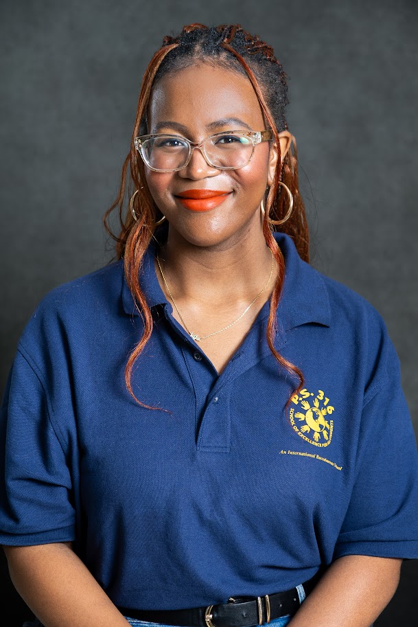 Staff member in blue school polo shirt