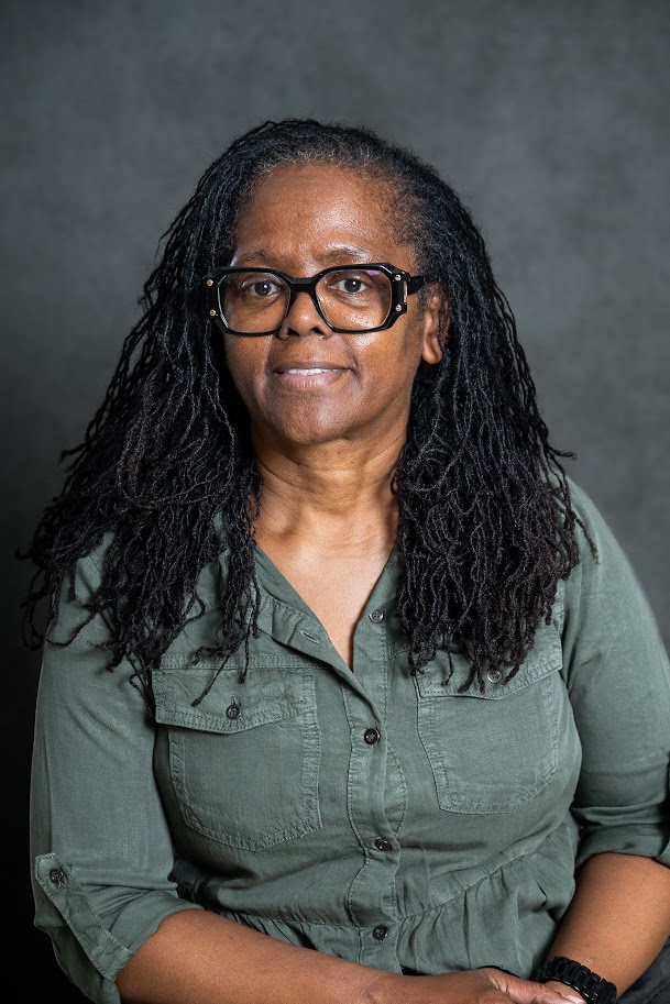 Professional headshot of staff member C. Bailey-Lopes