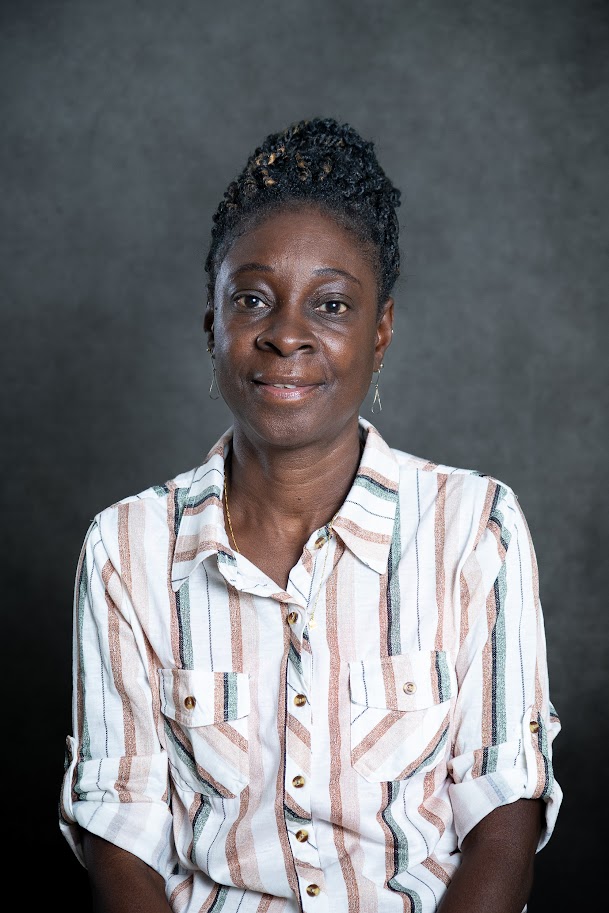 Professional headshot of staff member B. Thomas
