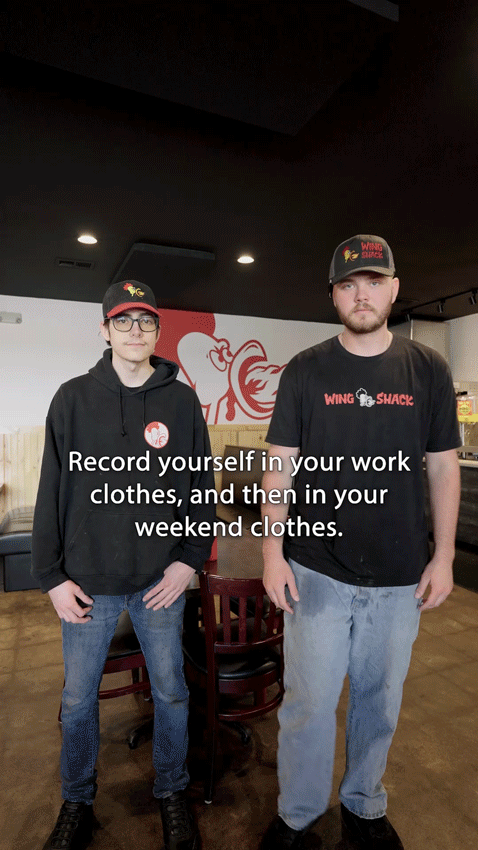 A gif of two employees from the Colorado based chain Wing Shack standing in one of their locations.