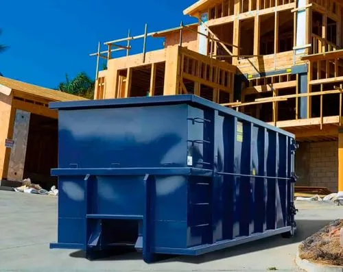 Blue roll off dumpster at a construction site in Warsaw, Indiana, illustrating available dumpster sizes