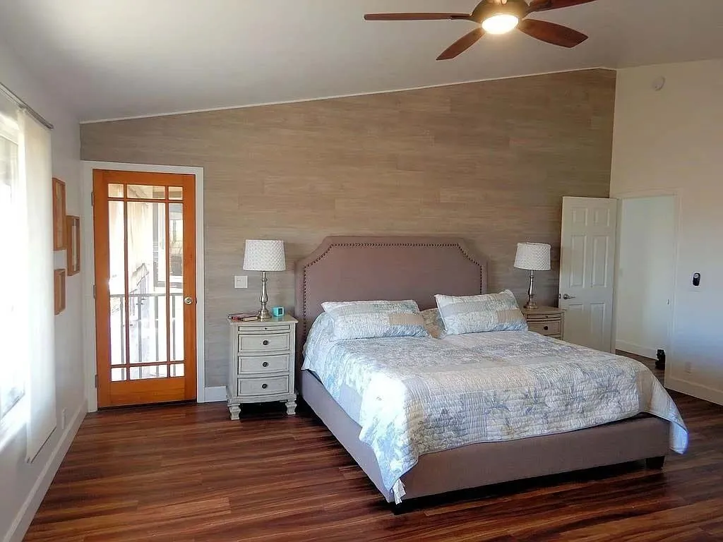 Primary bedroom with king bed and garden door