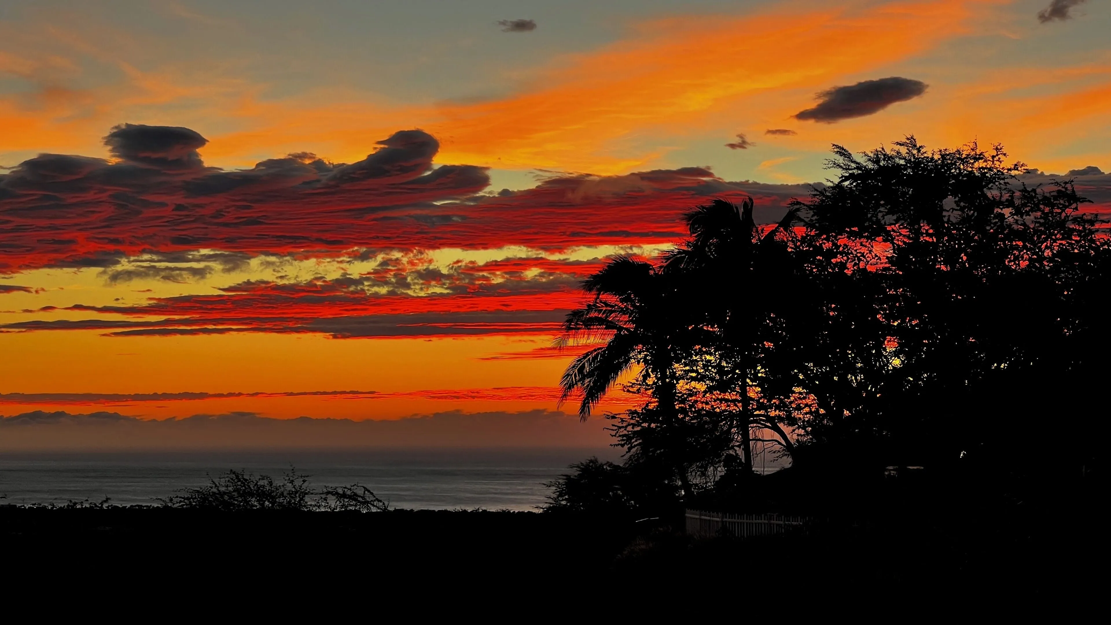 Fiery sunset over the ocean horizon