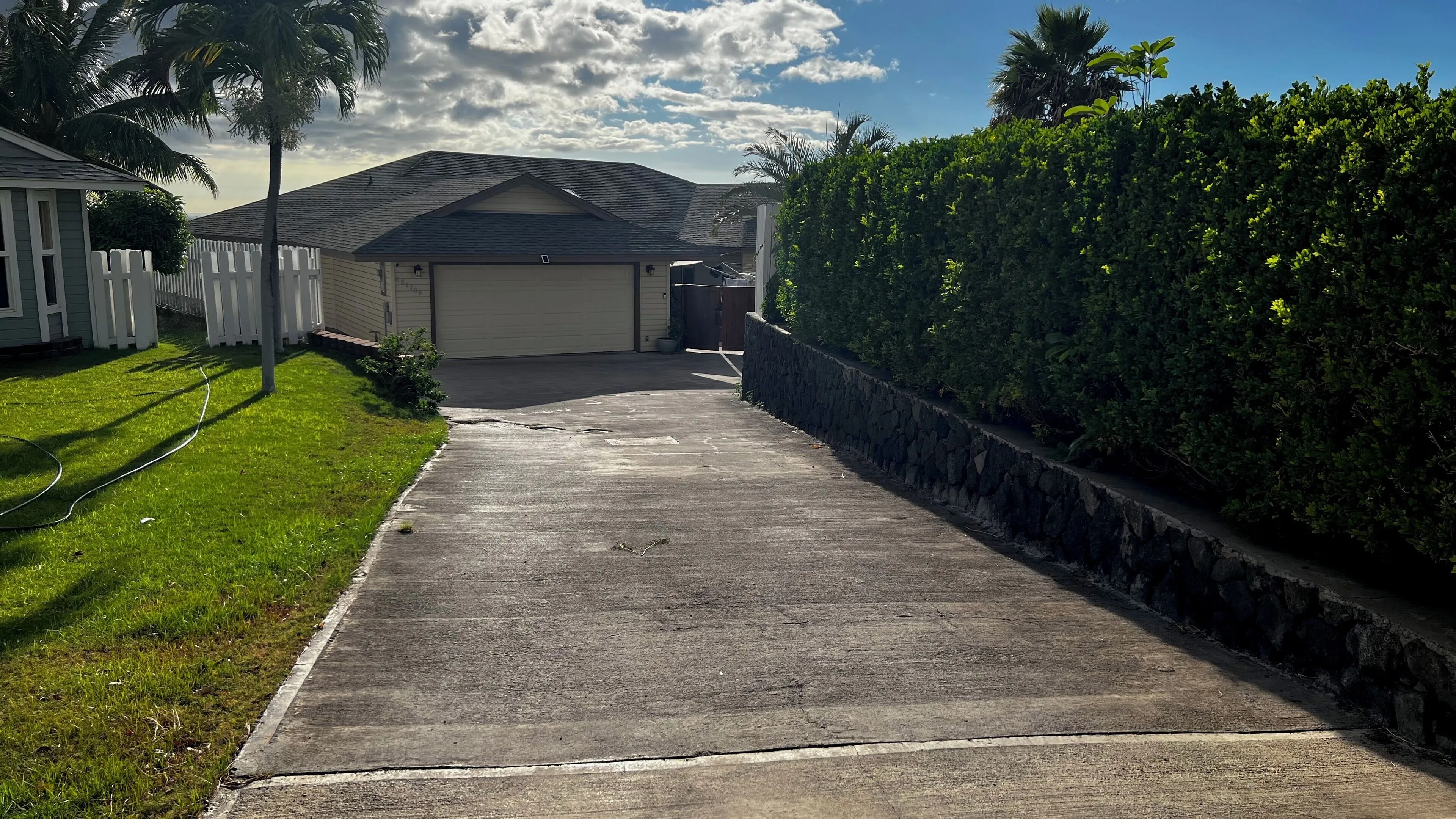 Private driveway lined with hedges