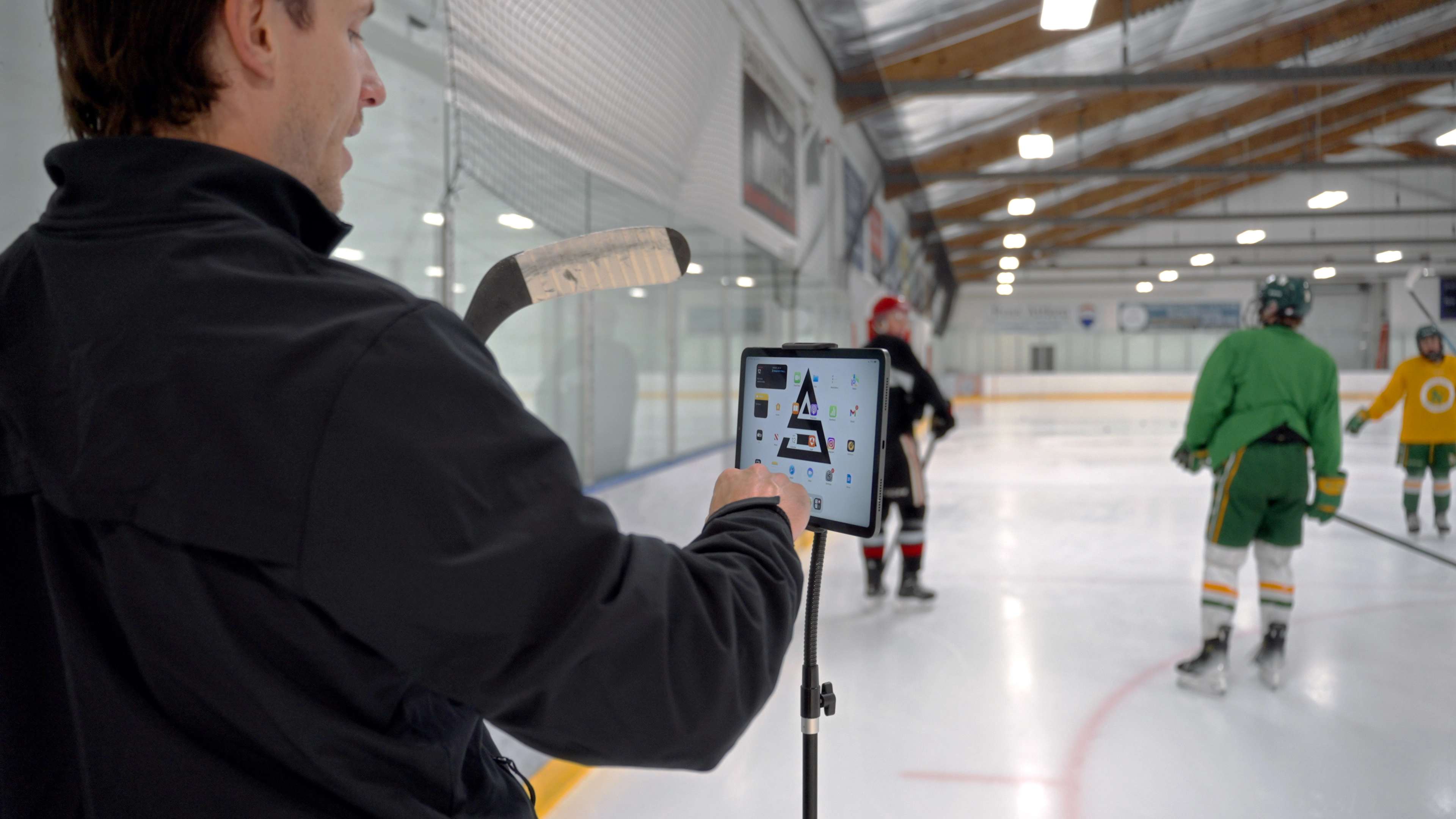 Image of Cole McBride coaching an on-ice skating session