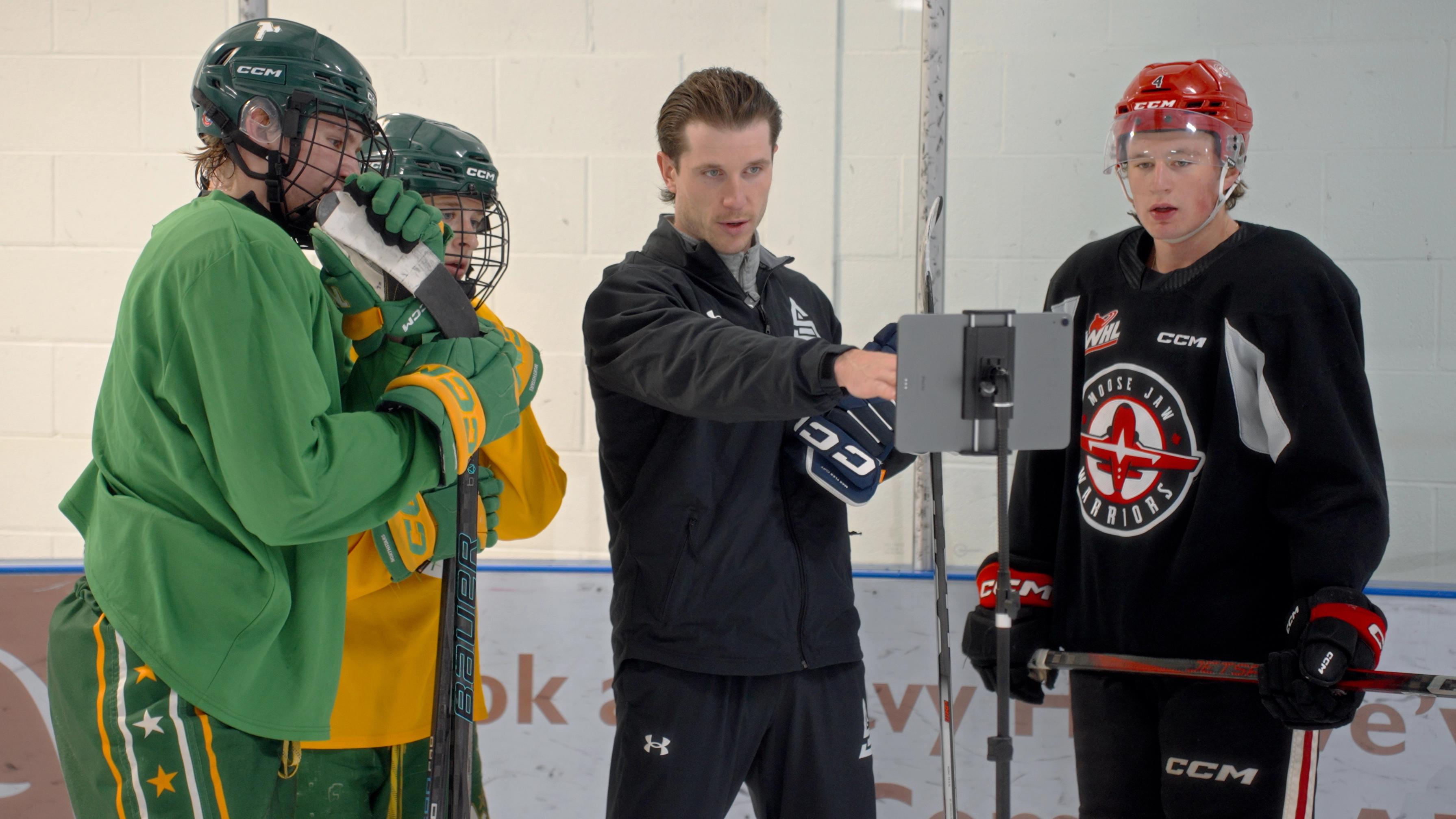 Image of Cole McBride coaching an on-ice skating session