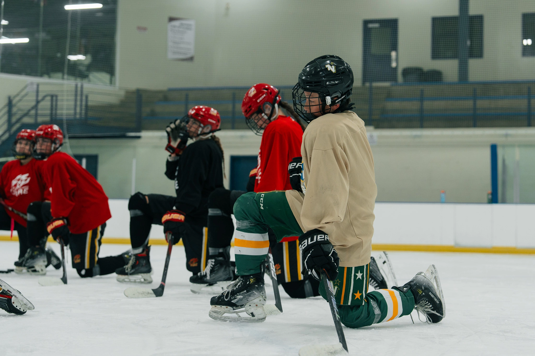 Image of a Snap Video Analytics players receiving on-ice coaching from Cole McBride