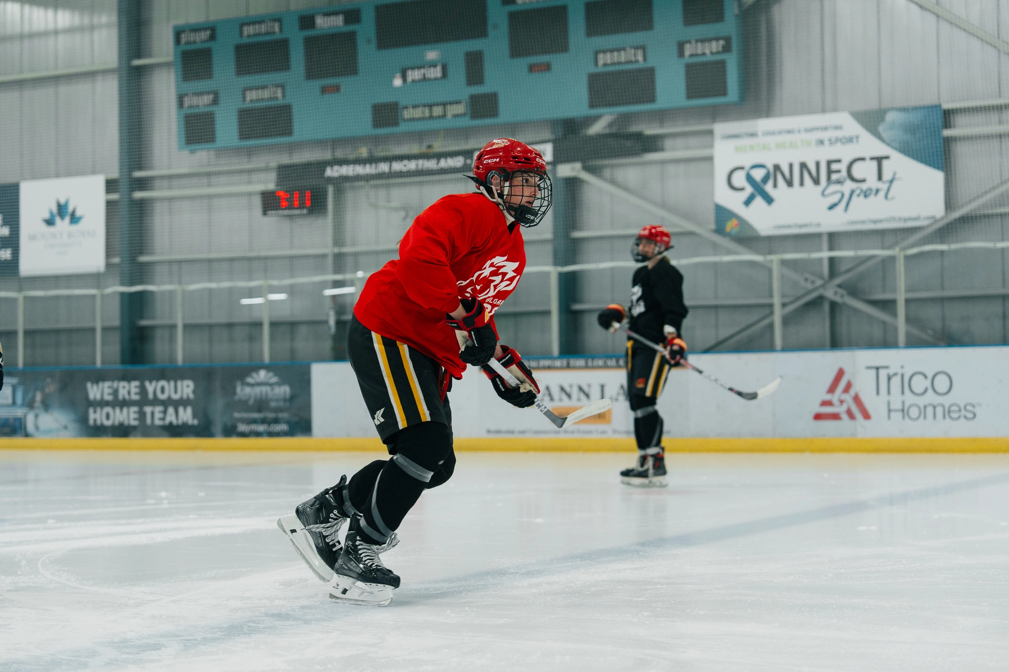 Image of a Snap Video Analytics player receiving on-ice coaching from Cole McBride