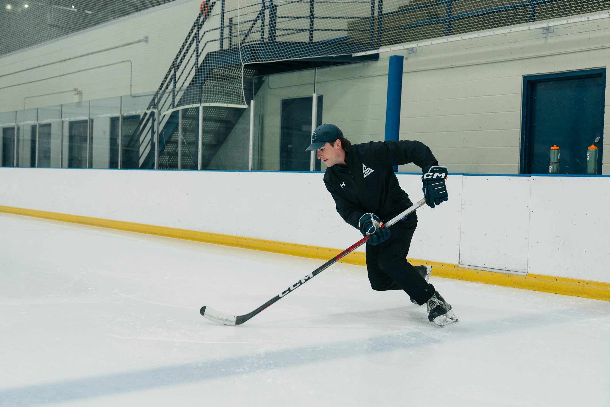 Image of Cole McBride coaching an on-ice skating session