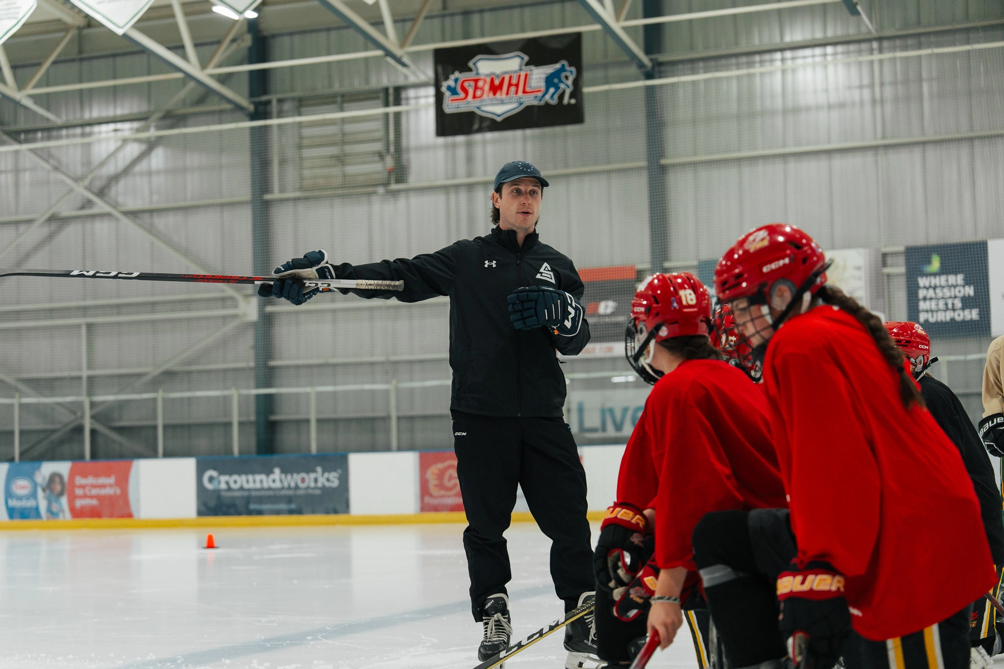 Image of Cole McBride coaching an on-ice skating session