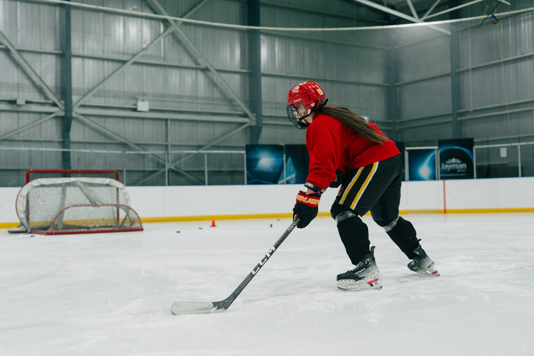 Image of a Snap Video Analytics player receiving on-ice coaching from Cole McBride
