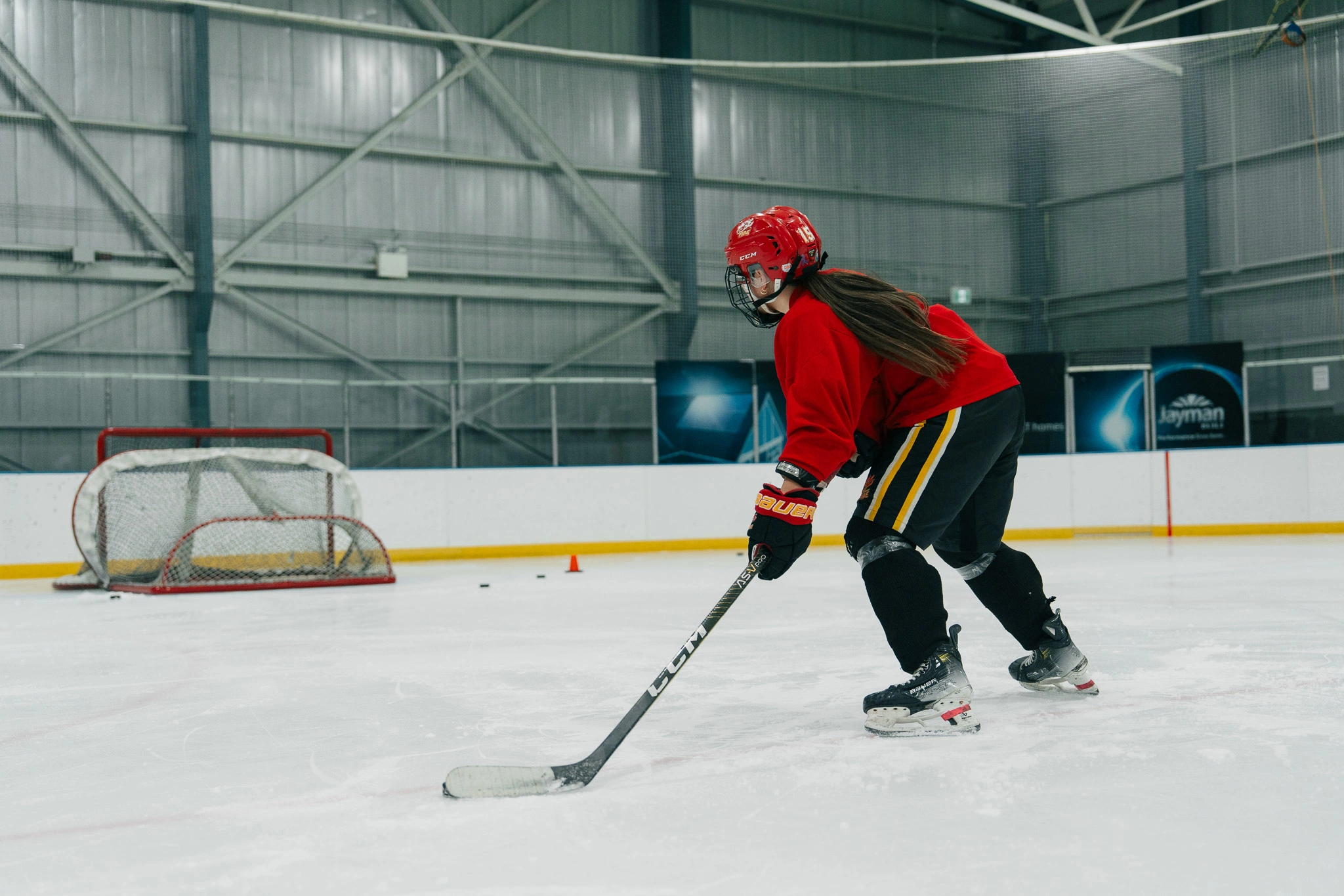 Image of a Snap Video Analytics player receiving on-ice coaching from Cole McBride