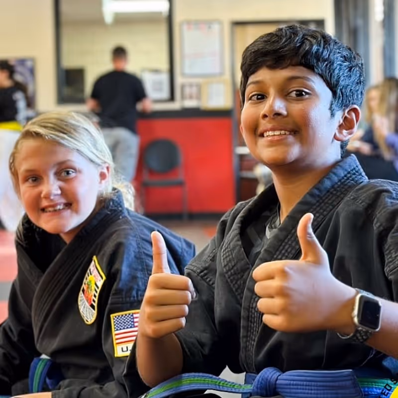 Two happy young karate students at USSD Yorba Linda
