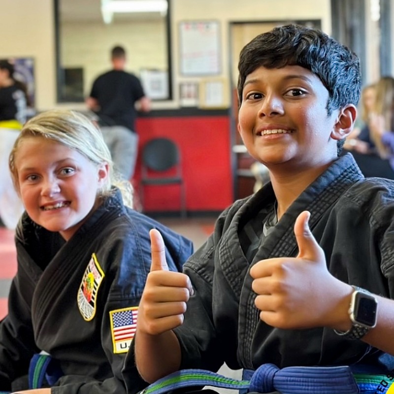 Two happy young karate students at USSD Yorba Linda