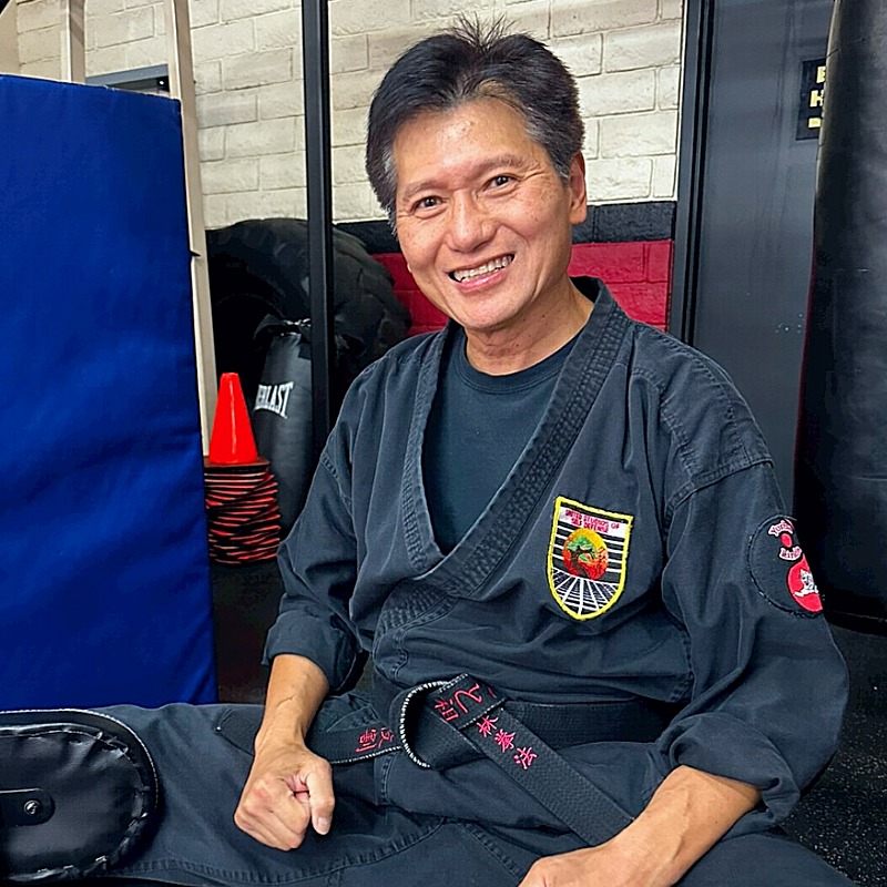 Older gentleman enjoying his time in the dojo before training.