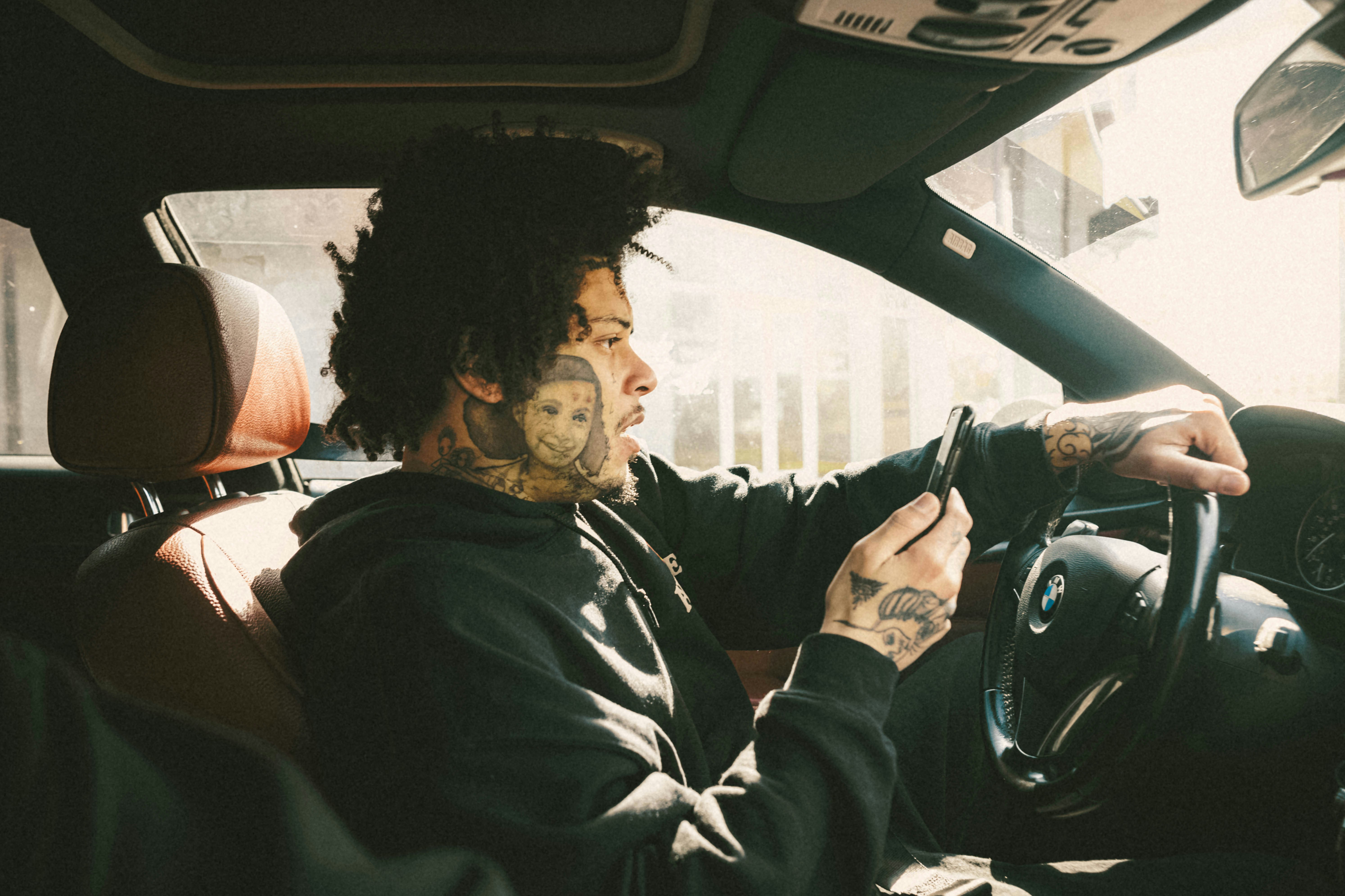 image of a professional preparing to drive a modern car for a transportation network