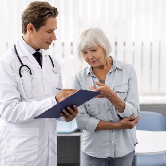 Woman asking a surgeon questions in a waiting room