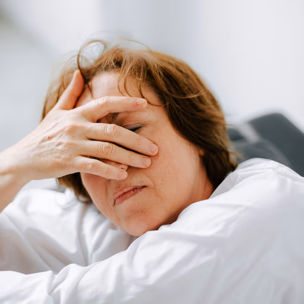 Woman suffering from severe headache or migraine.
