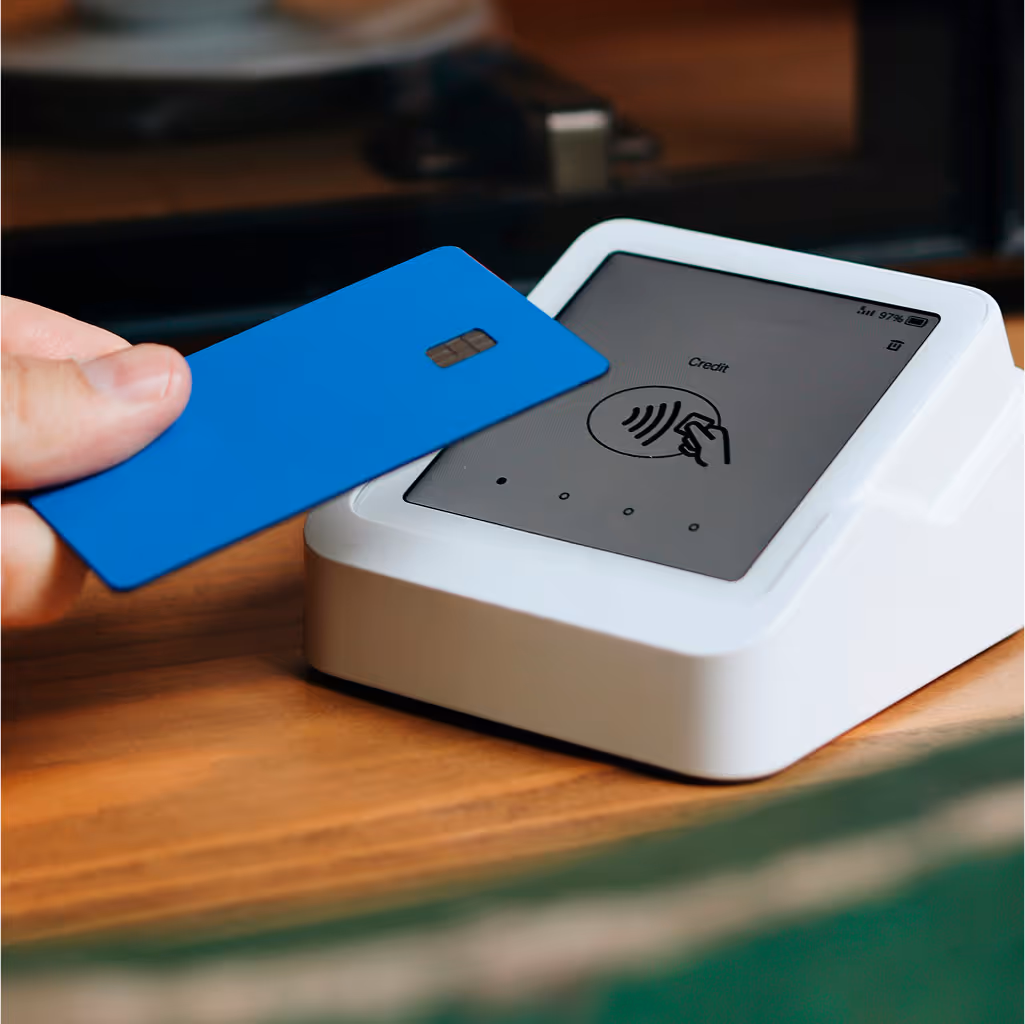 Paying medical bill with contactless credit card.