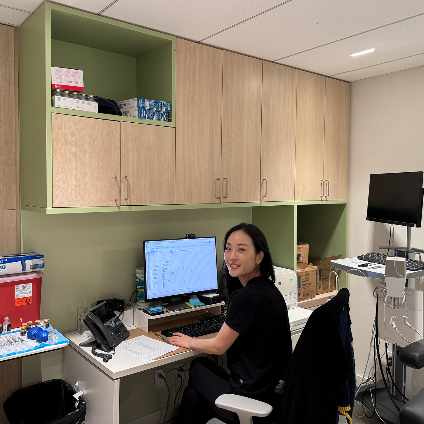 Female nurse at New York Headache Center answering patient call.