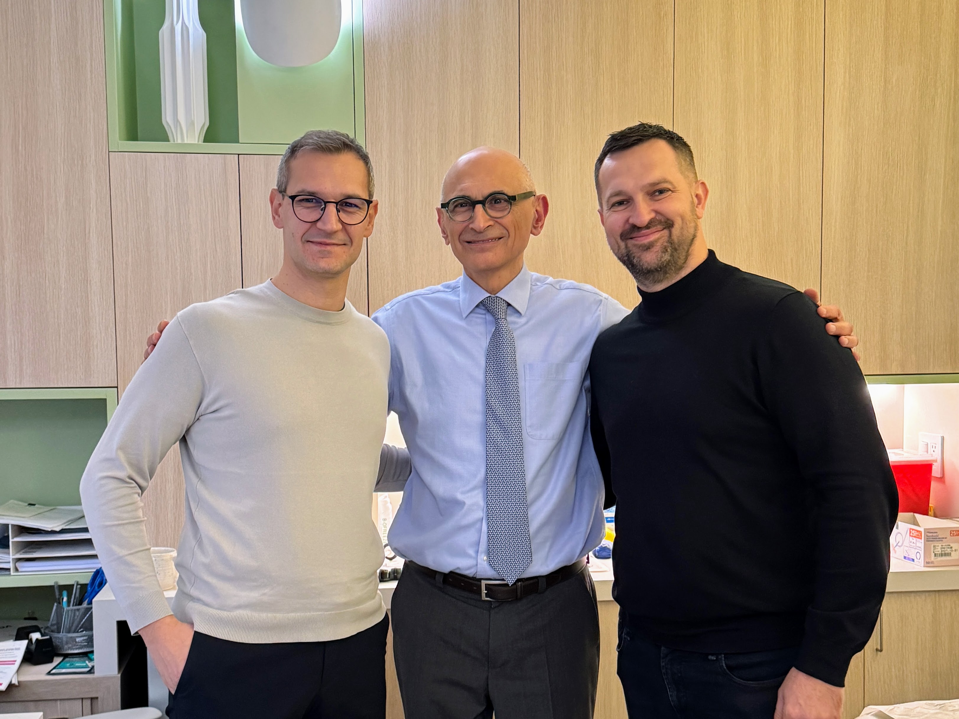 Visiting doctor at NYHC holding the book ‘The End of Migraines.’