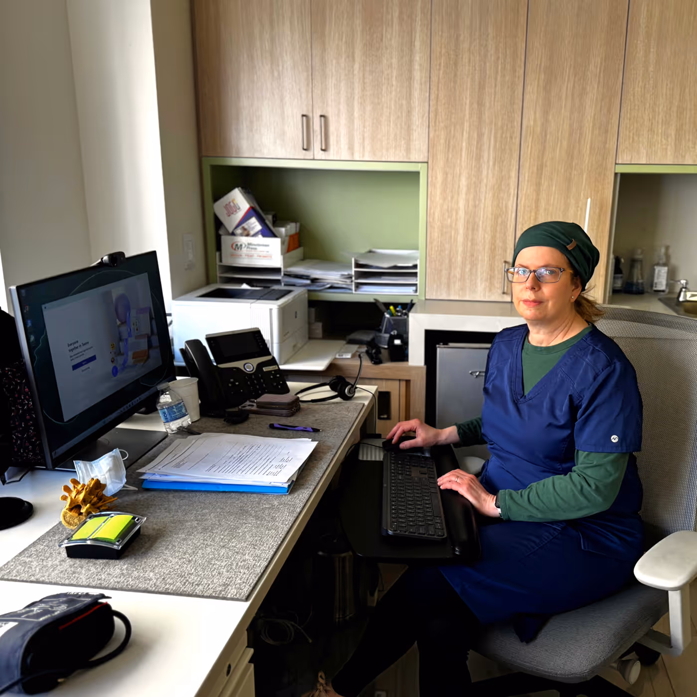 Female nurse at New York Headache Center answering patient call.