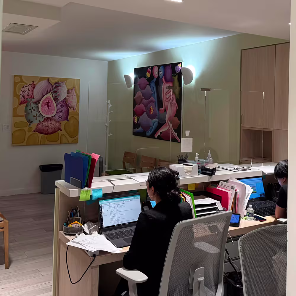 Patient reading medical research book on migraine treatment.