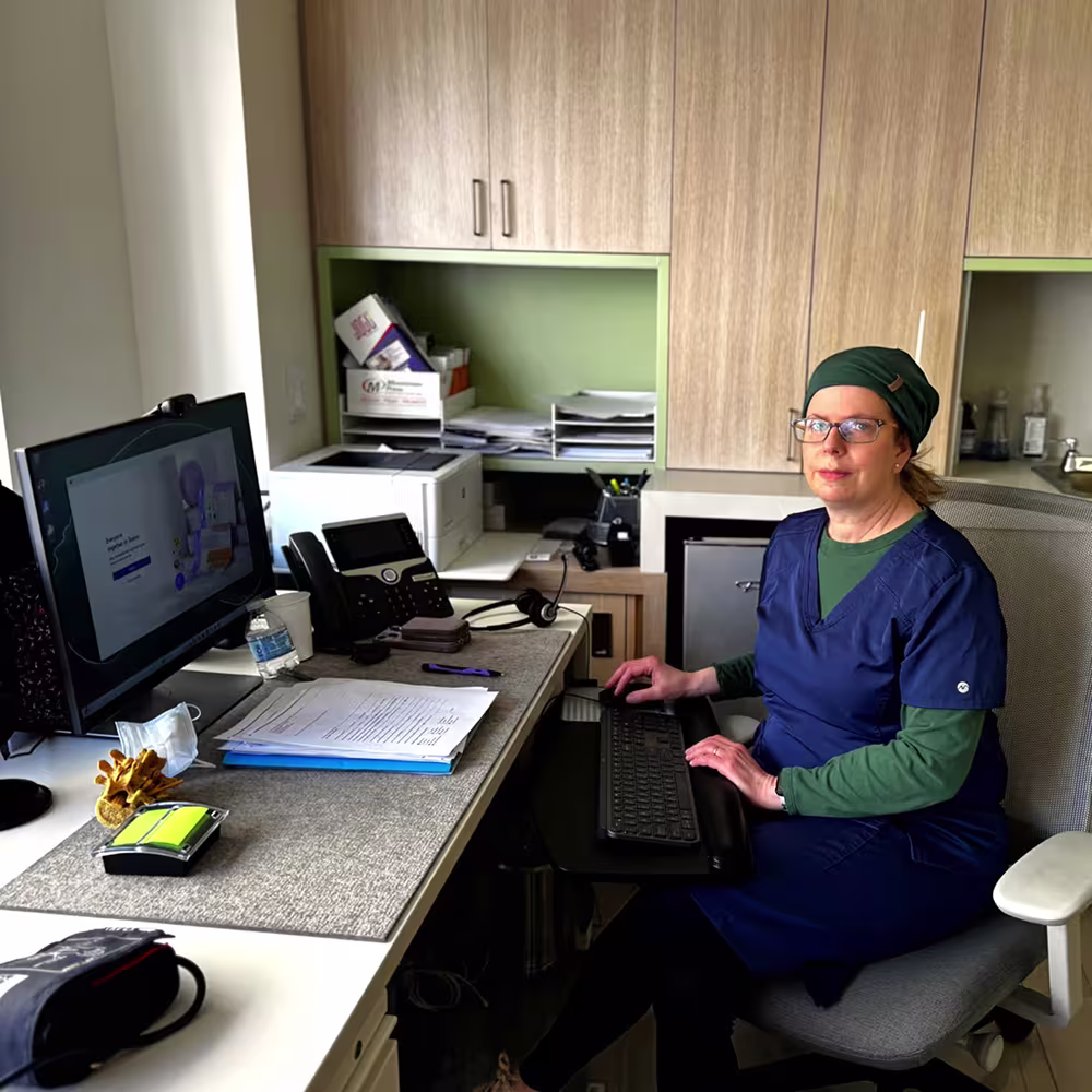 Female nurse at New York Headache Center answering patient call.