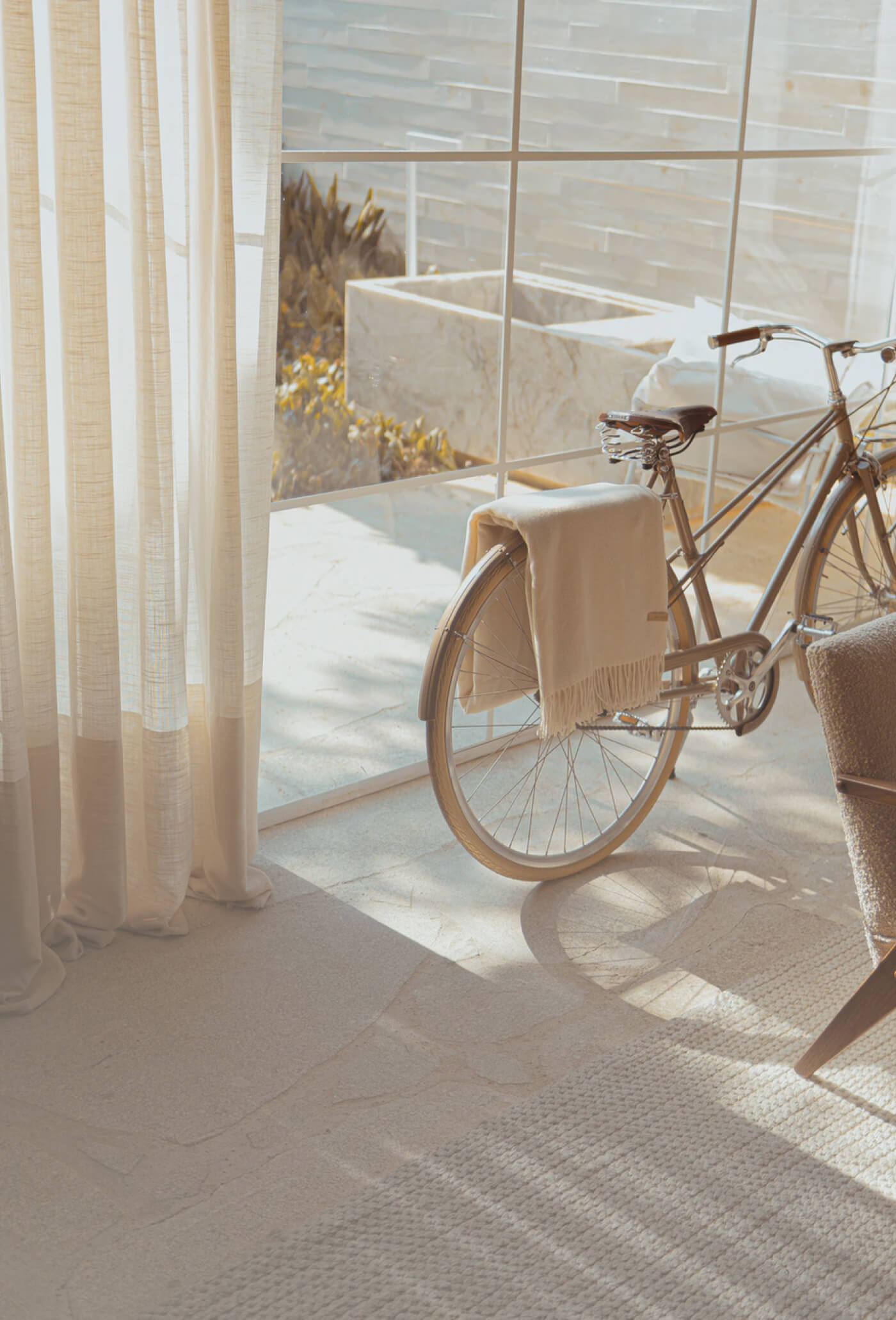 A bike set in a beige living room.