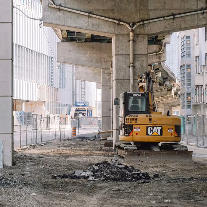 Vacant construction site with digger