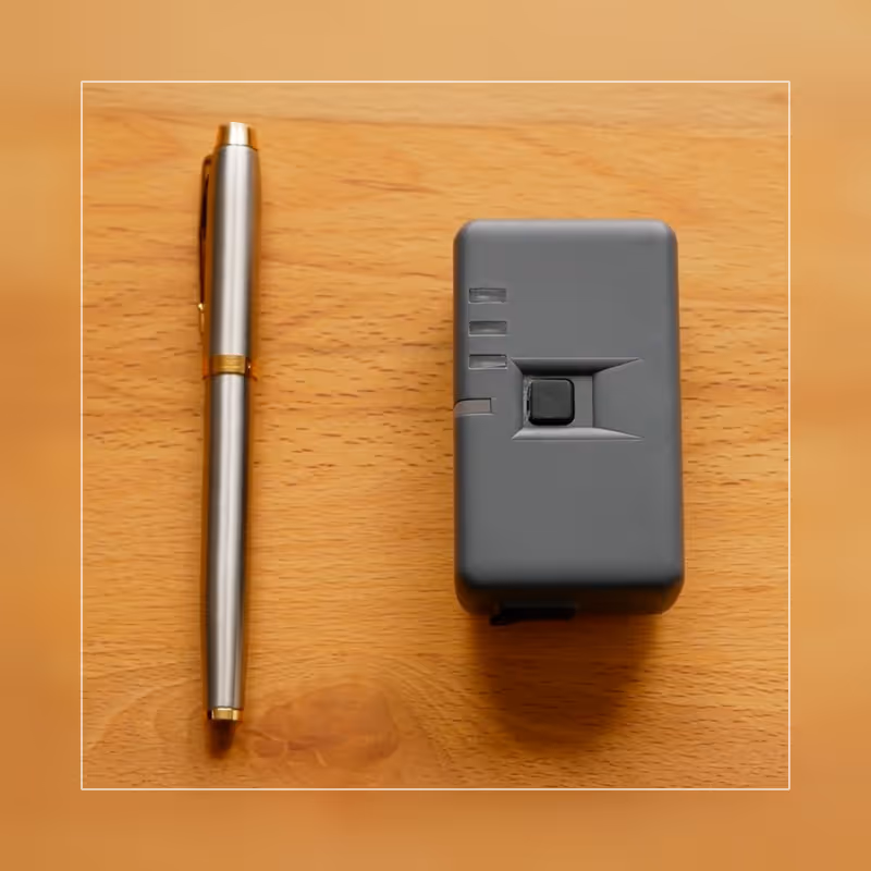 Size comparison of our device with regular pen