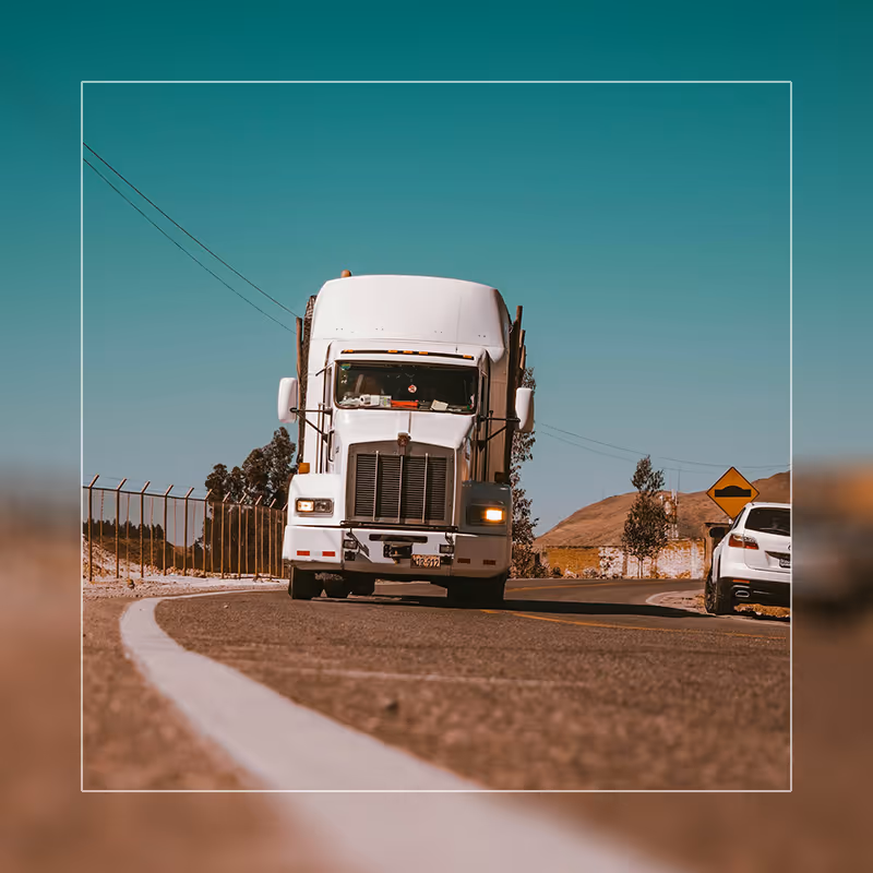 Semi truck roaming roads in summer
