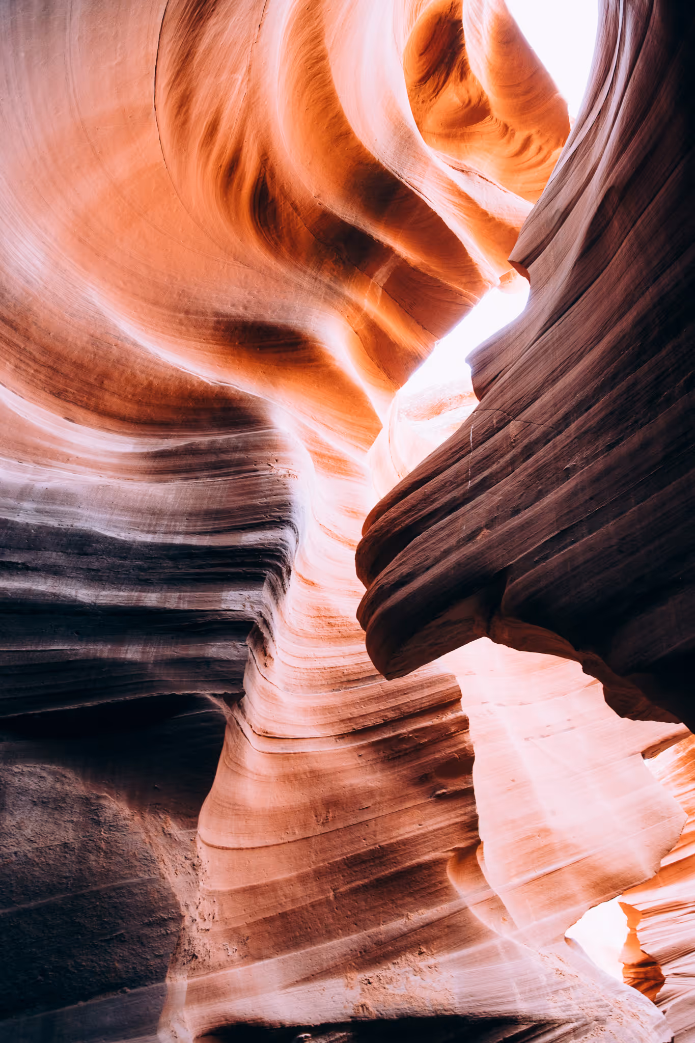 Close-up of rugged, reddish-brown rocky terrain with sharp ridges and crevices.