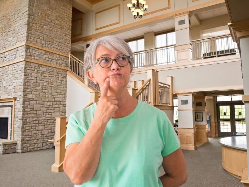 Woman considering the lobby in the Castle Town Center at Wesley Willows