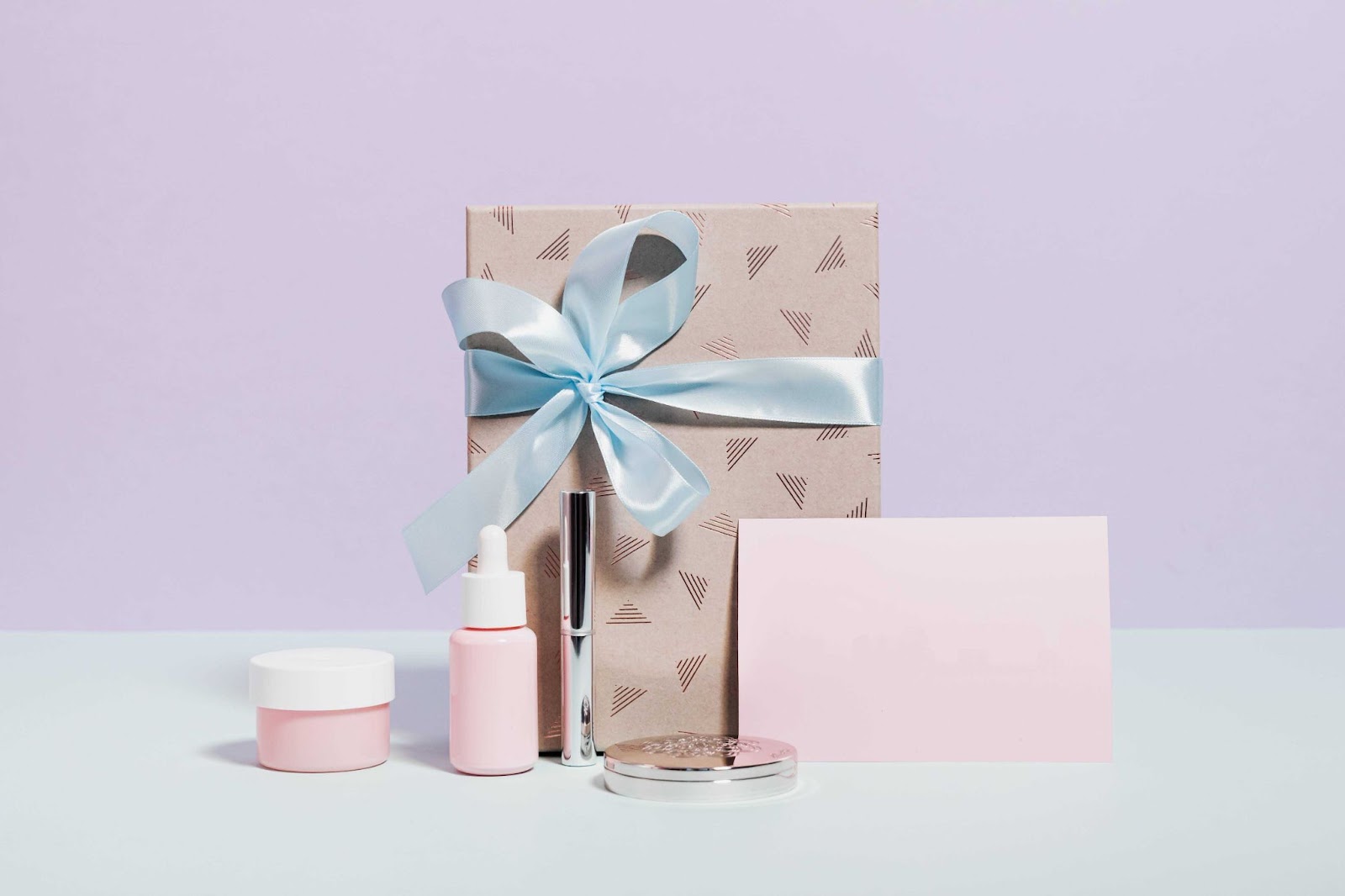 Custom packaging for cosmetics brands including flier, glass bottles, and packaging box