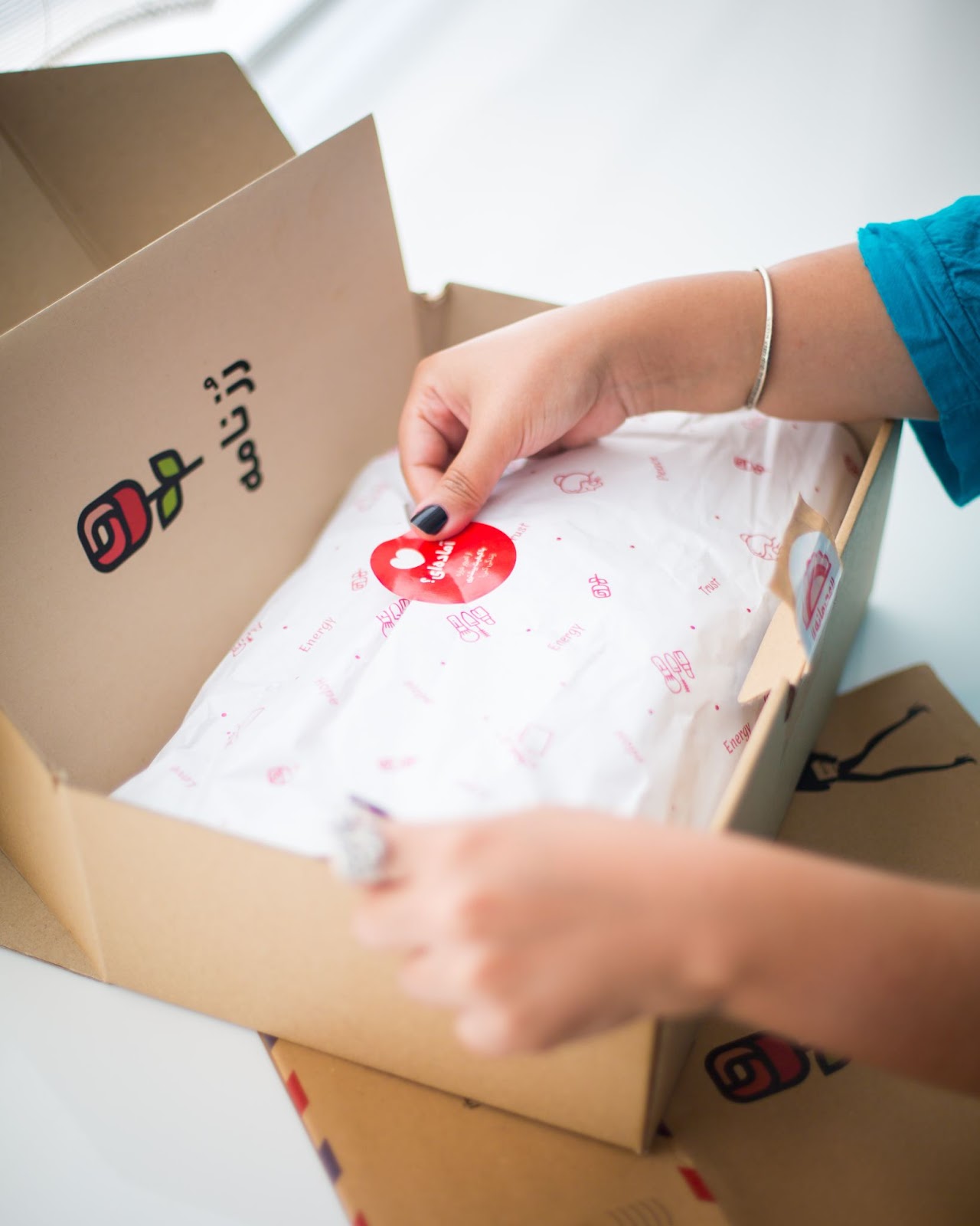 a brand uses stickers and a custom packaging box