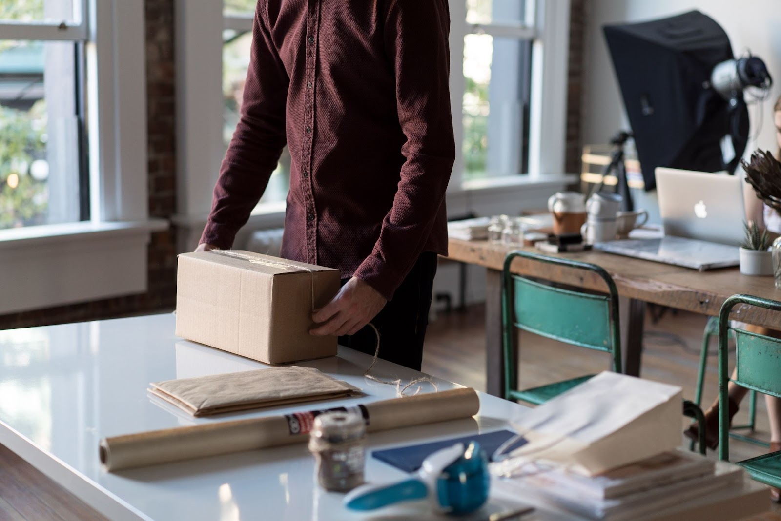 e-commerce seller packaging up an SKU ready to be shipped