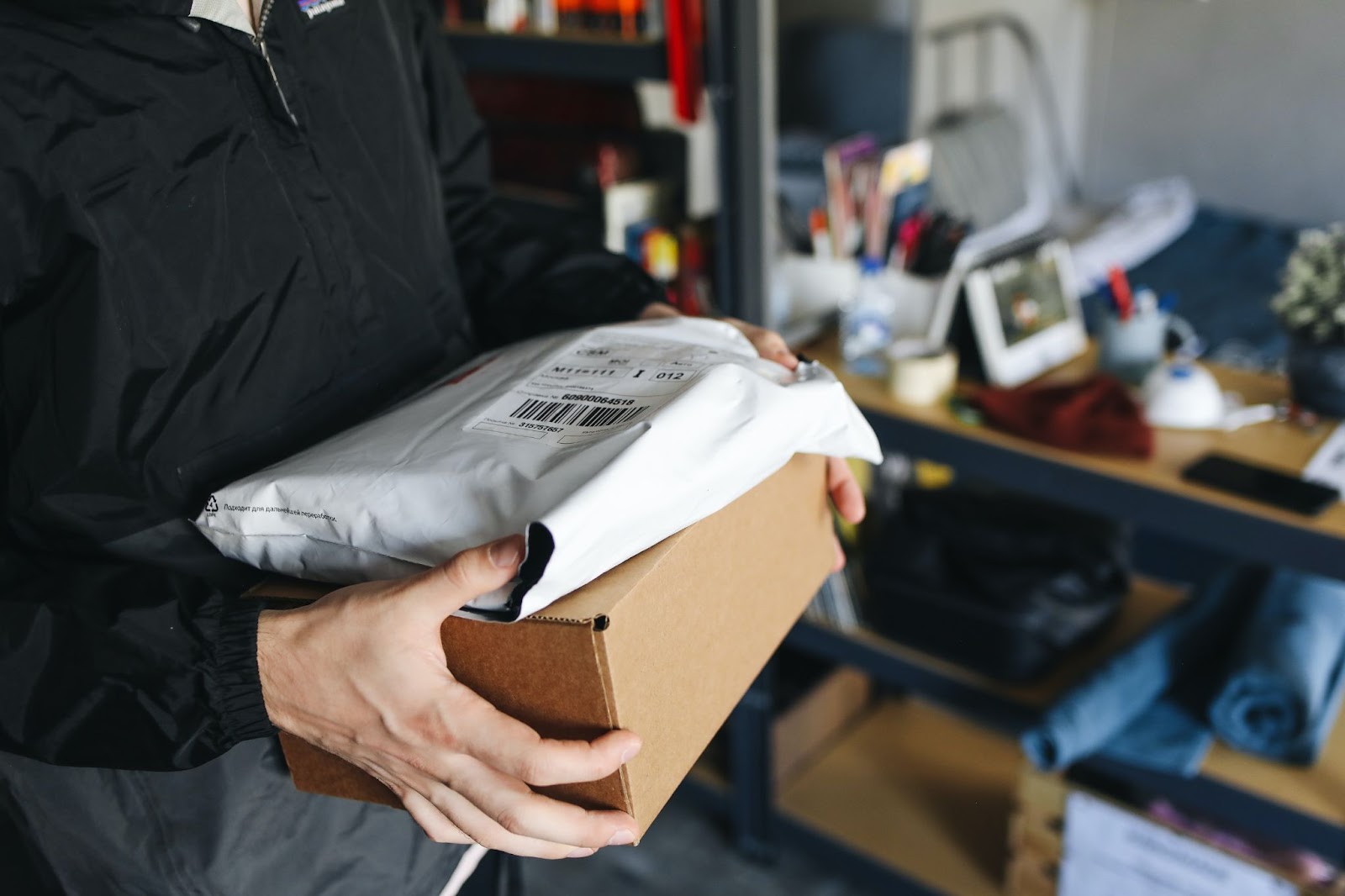 e-commerce retailer packages items in corrugated box and polymailers