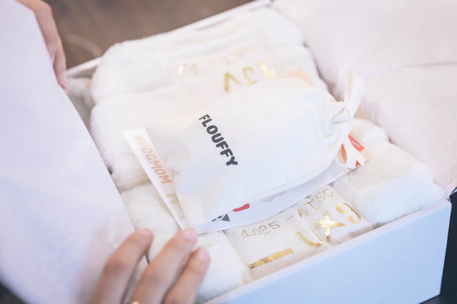 customer opens a package to find an item in cotton packaging