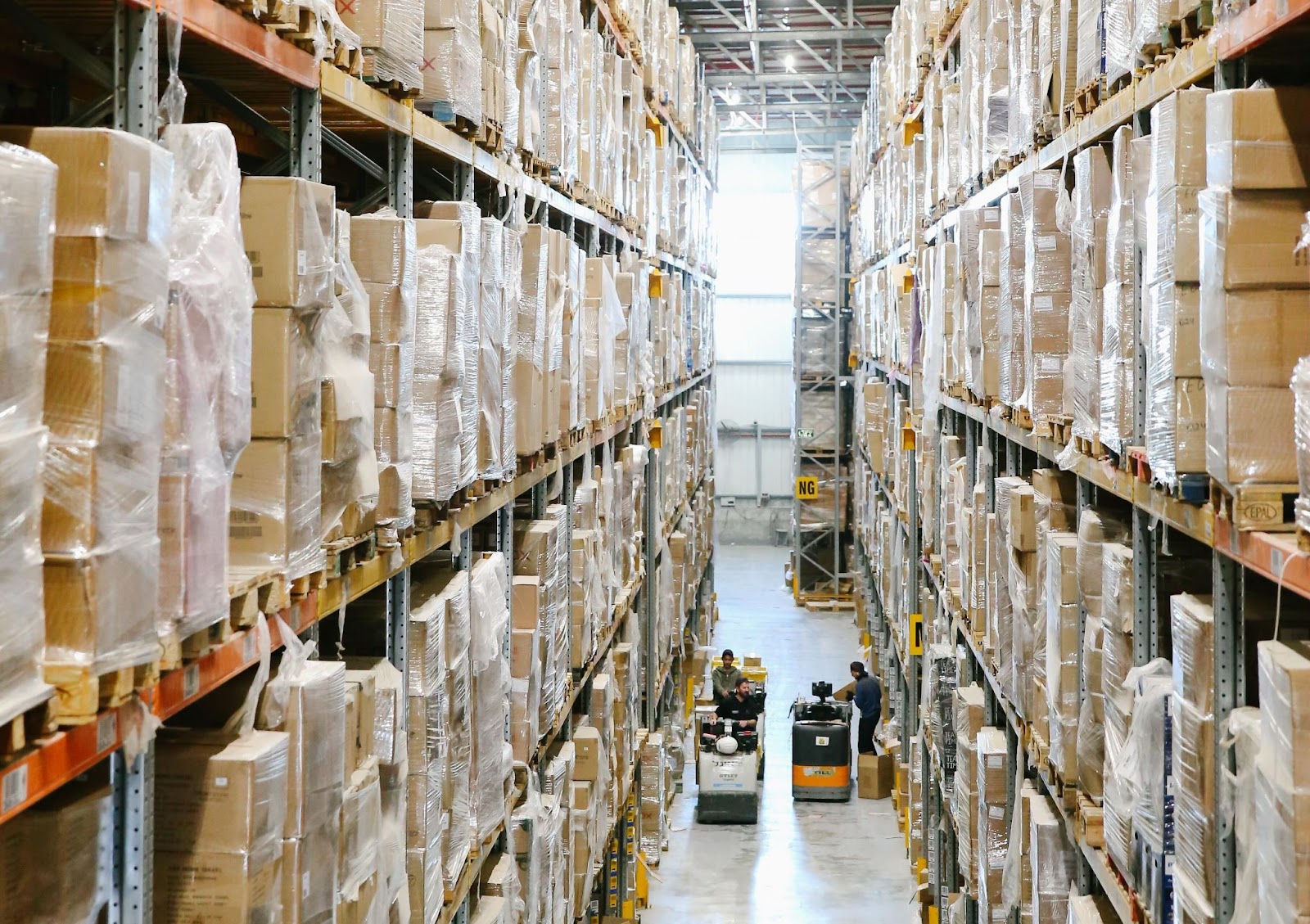 Warehouse associates pick orders according to a Warehouse Management System