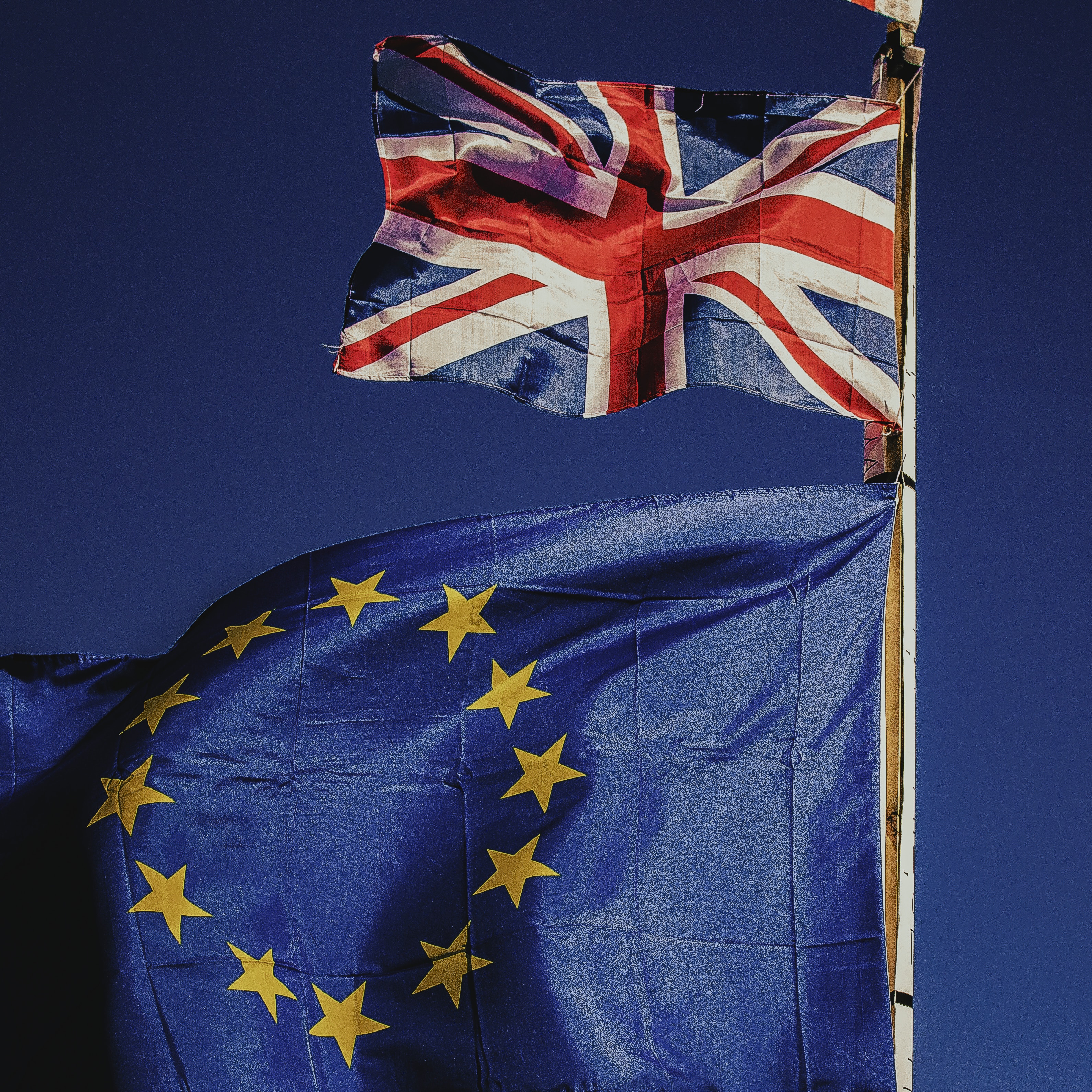 UK and EU flags separated from each other representing brexit